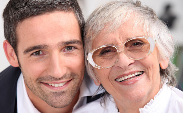 John and his mother smiling